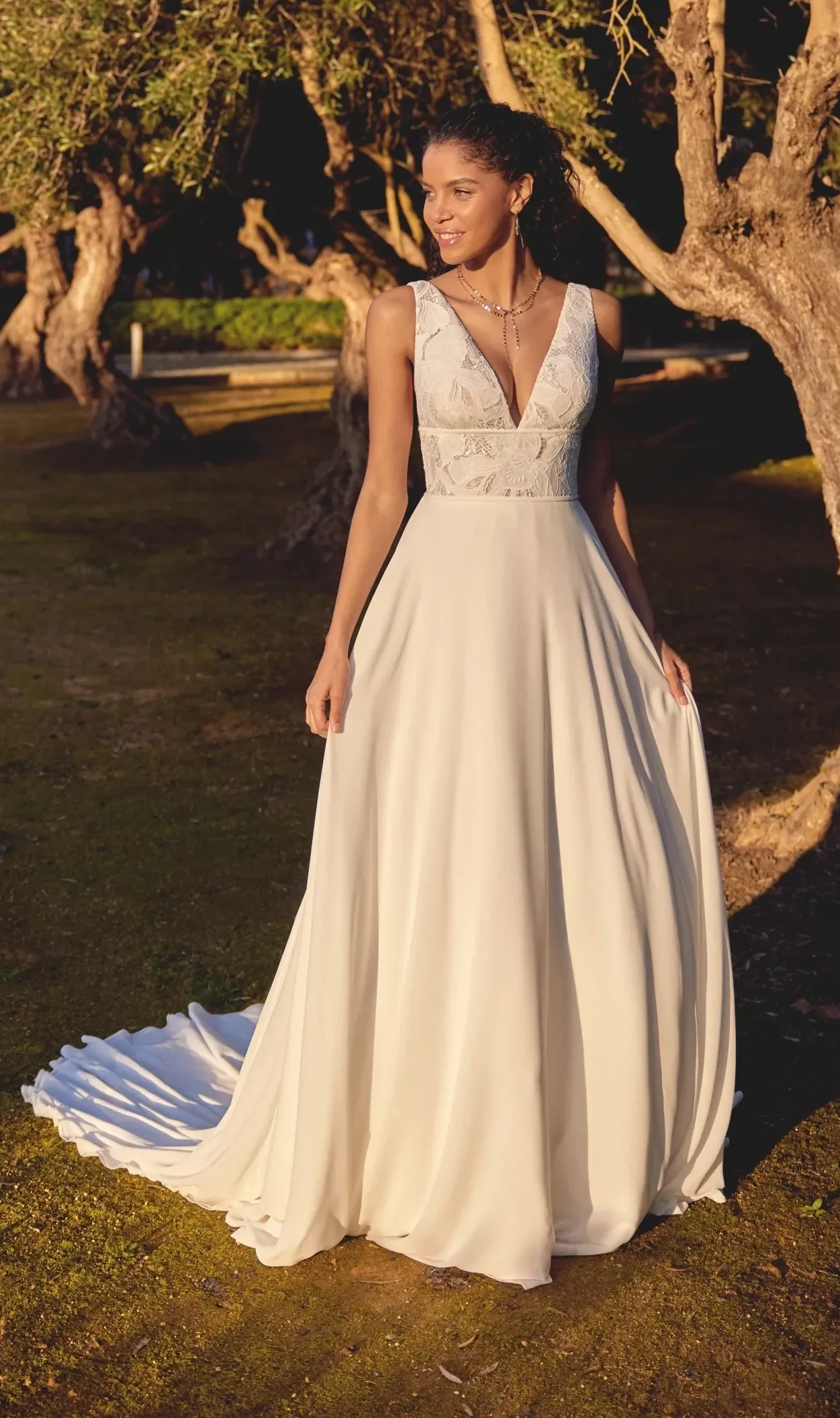 Model wearing a Lillian West gown