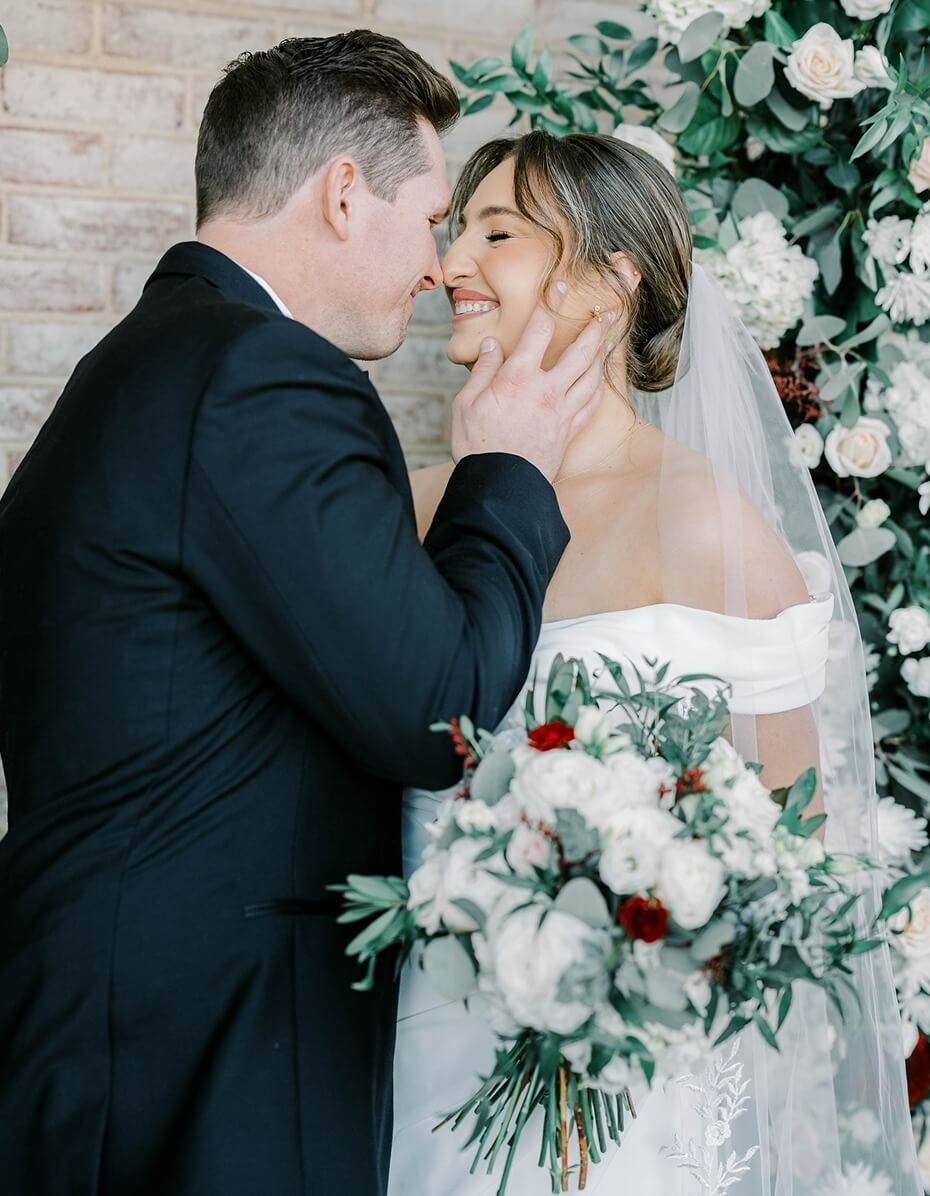 Сouple wearing a white gown and a black suit
