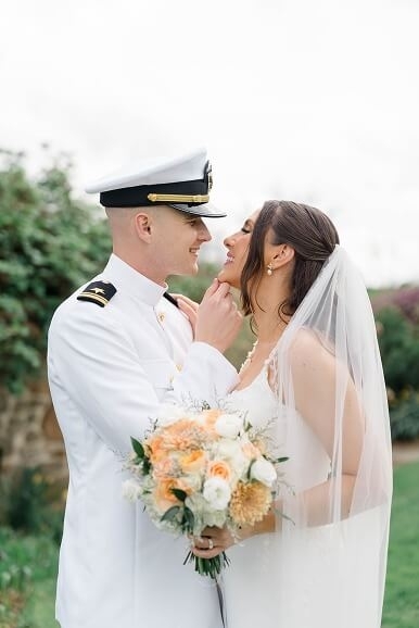 Сouple wearing a white gown and a white suit