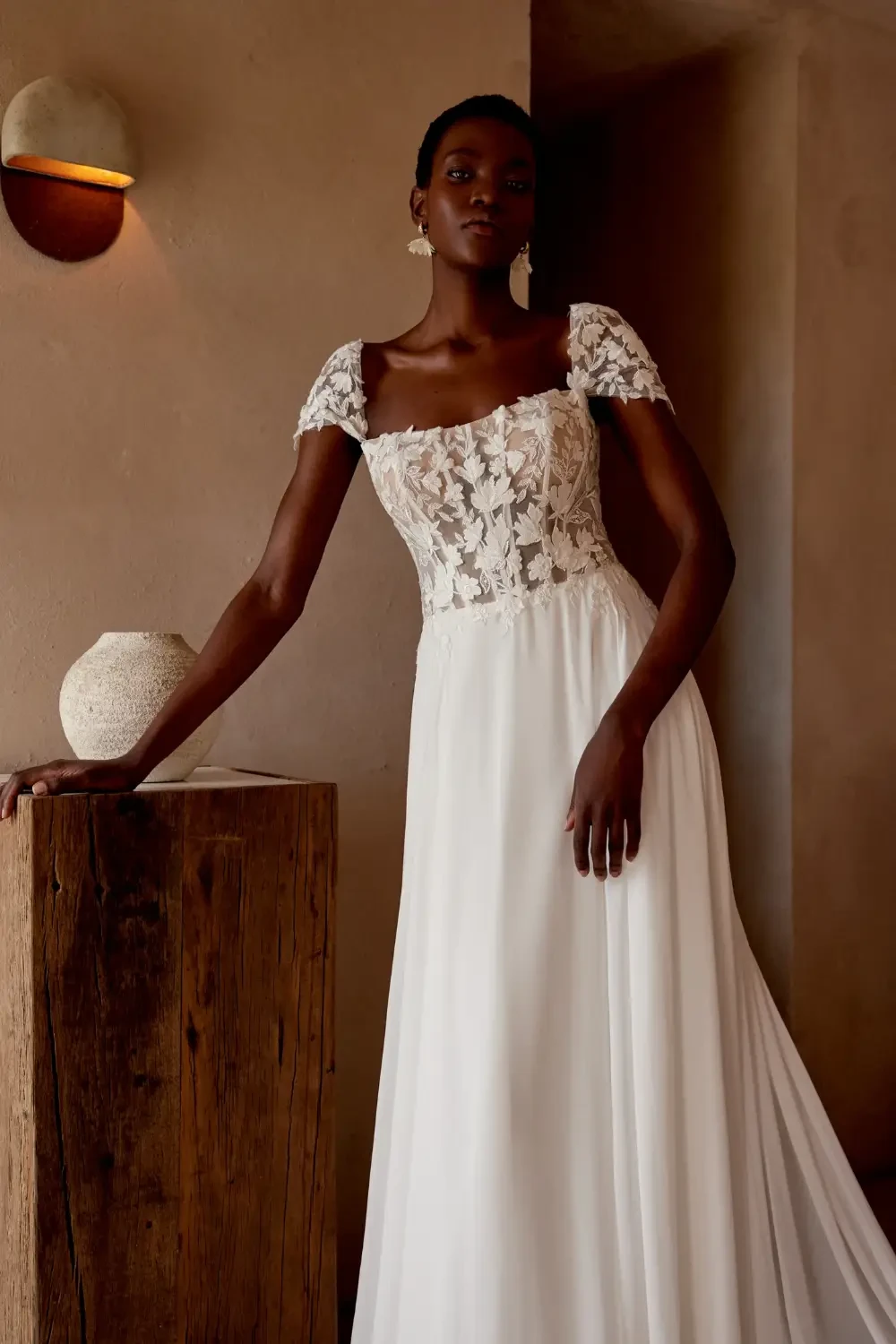 Model wearing a Lillian West gown
