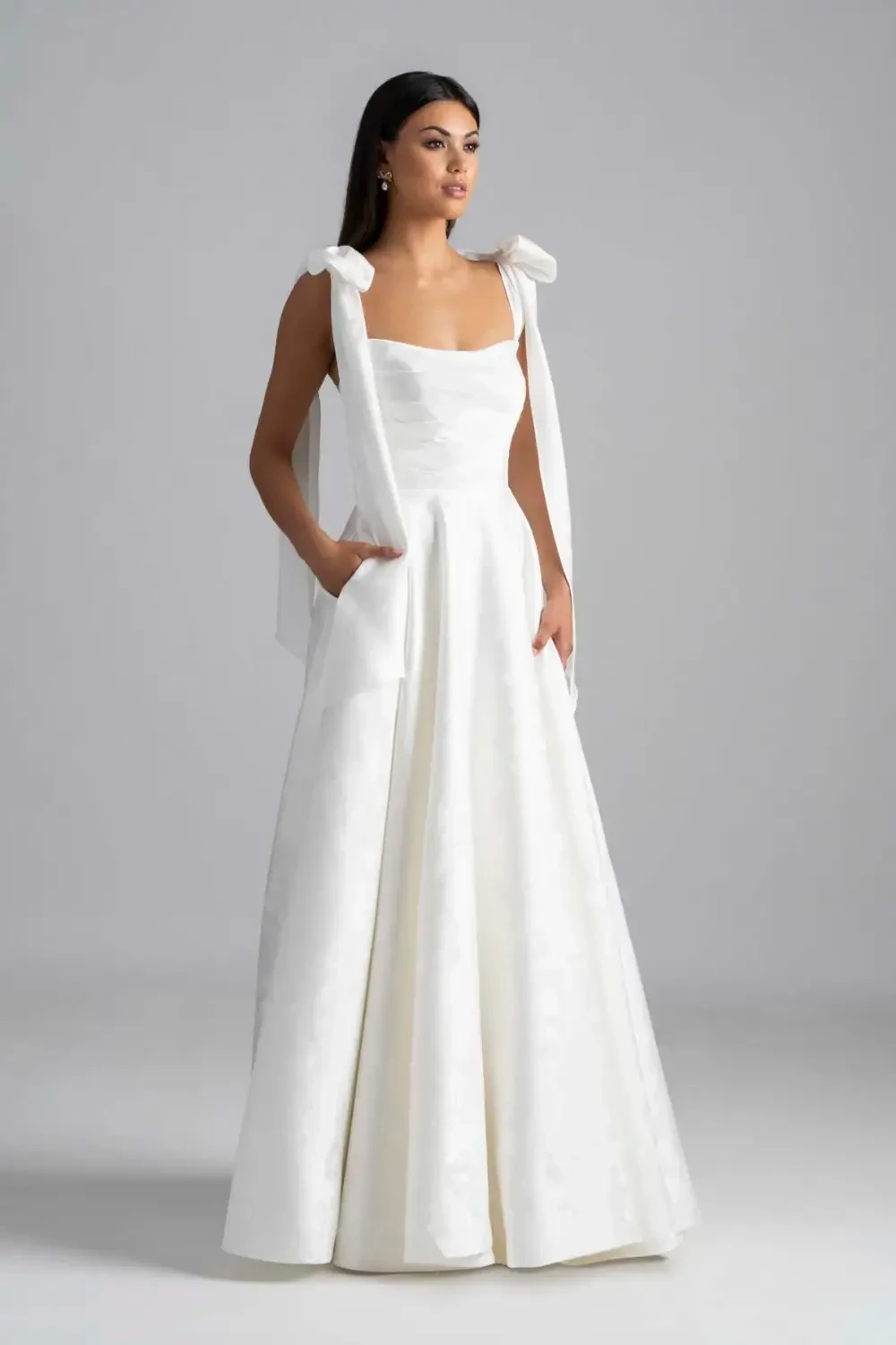 Model wearing a Madison James gown
